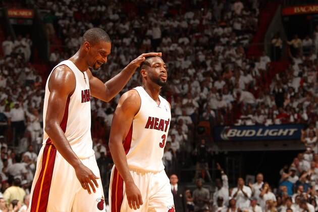 MIAMI, FL - April 20:  Chris Bosh #1 and Dwyane Wade #3 of the Miami Heat celebrate against the Charlotte Bobcats during Game One of the Eastern Conference Quarterfinals of the 2014 NBA playoffs at the American Airlines Arena in Miami, Florida on April 20, 2014. NOTE TO USER: User expressly acknowledges and agrees that, by downloading and/or using this photograph, user is consenting to the terms and conditions of the Getty Images License Agreement. Mandatory copyright notice: Copyright NBAE 2014 (Photo by Issac Baldizon/NBAE via Getty Images)