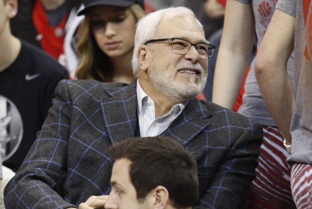 New York Knicks president Phil Jackson is seen before the start of an NCAA college basketball game between Ohio State and Nebraska in Columbus, Ohio, Thursday, Feb. 26, 2015.(AP Photo/Paul Vernon)