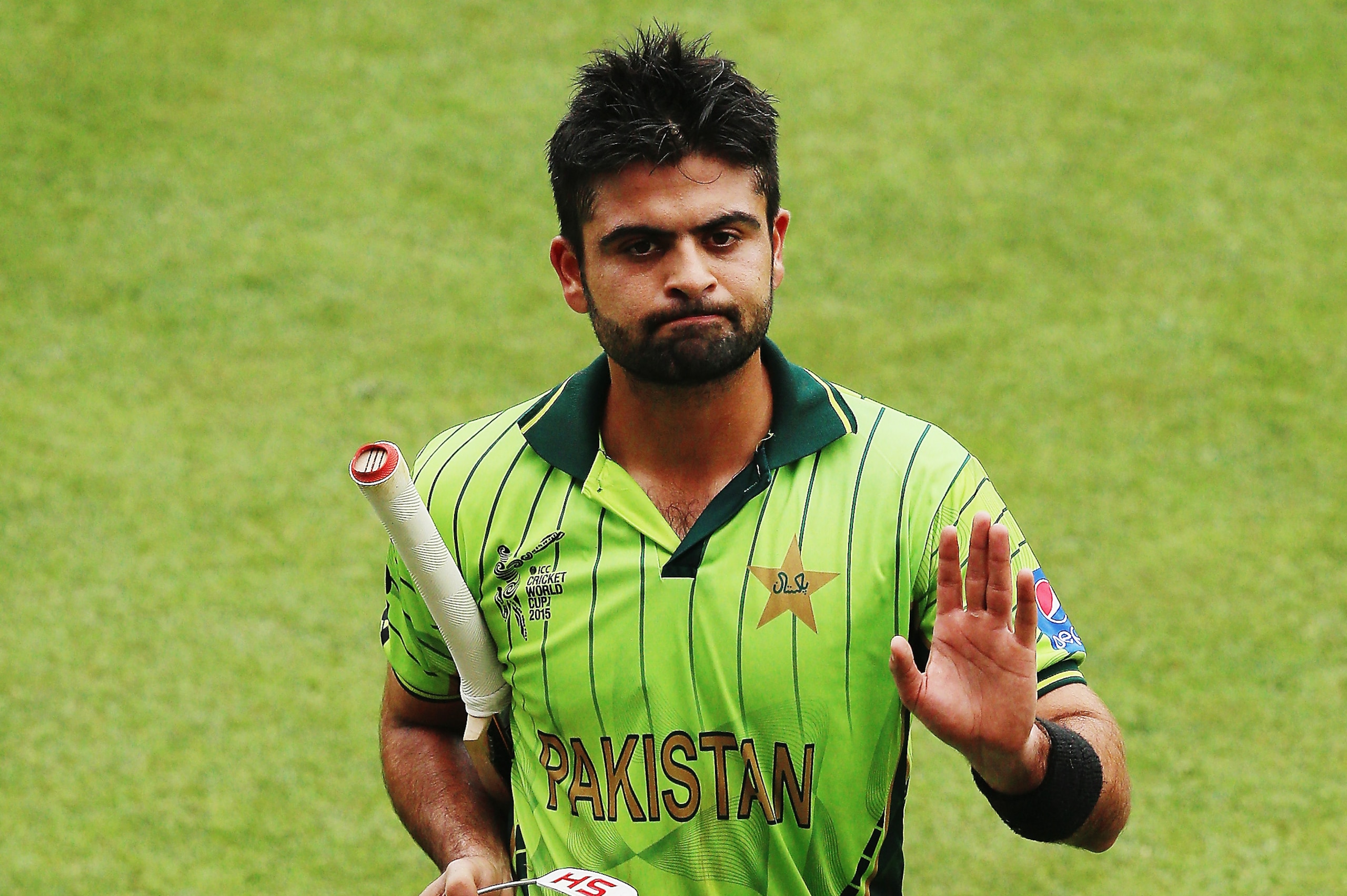 NAPIER, NEW ZEALAND - MARCH 04:  Ahmed Shehzad of Pakistan walks off after being run out during the 2015 ICC Cricket World CUp match between Pakistan and the United Arab Emirates at McLean Park on March 4, 2015 in Napier, New Zealand.  (Photo by Hannah Peters/Getty Images)