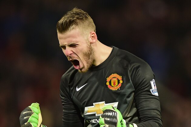 MANCHESTER, ENGLAND - FEBRUARY 11:  David De Gea of Manchester United celebrates his team's second goal by Chris Smalling during the Barclays Premier League match between Manchester United and Burnley at Old Trafford on February 11, 2015 in Manchester, England.  (Photo by Jamie McDonald/Getty Images)