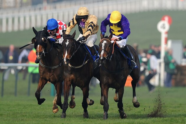 CHELTENHAM, ENGLAND - MARCH 14:  Davy Russell on Lord Windermere (R) win from David Casey on On His Own (centre) and Tom Scudamore on The Giant Bolster during the Cheltenham Festival at Cheltenham Racecourse on March 14, 2014 in Cheltenham, England.  (Photo by Mike Hewitt/Getty Images)