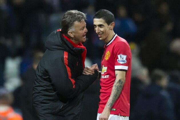 Manchester United's manager Louis van Gaal, left, speaks with Angel Di Maria during the English FA Cup Fifth Round soccer match between Preston and Manchester United at Deepdale Stadium in Preston, England, Monday Feb. 16, 2015.  (AP Photo/Jon Super)
