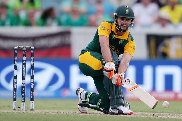South Africa's Rilee Rossouw hits the ball while batting against Ireland during their Cricket World Cup Pool B match in Canberra, Australia, Tuesday, March 3, 2015. (AP Photo/Rob Griffith)