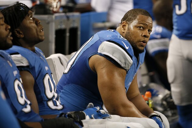Detroit Lions defensive tackle Ndamukong Suh (90) watches action from the sideline during the second half of an NFL wildcard playoff football game against the Dallas Cowboys, Sunday, Jan. 4, 2015, in Arlington, Texas. (AP Photo/Tony Gutierrez)