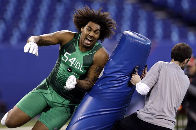 USC defensive lineman Leonard Williams runs a drill at the NFL football scouting combine in Indianapolis, Sunday, Feb. 22, 2015. (AP Photo/David J. Phillip)