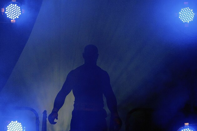 LONDON - FEBRUARY 10: Deathwish Dave Legeno walks out into the arena during the Cage Rage Championship 20 Born to fight event at Wembley Arena on February 10, 2007 in London, England. Cage Fighting also known as MMA Mixed Martial Arts is a mixed fighting style combat sport with a steadily growing international fan base. MMA is an evolving combat sport where competitors combine different disciplines that include jiu-jitsu, judo, karate, boxing, kickboxing, wrestling and others to their strategic and tactical advantage in a competetive arena.  (Photo by Daniel Berehulak/Getty Images)