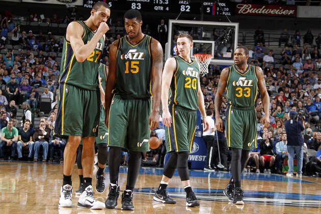 DALLAS, TX - FEBRUARY 11: Rudy Gobert #27, Derrick Favors #15, Gordon Hayward #20, and Trevor Booker #33 of the Utah Jazz stand on the court during a game against the Dallas Mavericks on February 11, 2015 at the American Airlines Center in Dallas, Texas. NOTE TO USER: User expressly acknowledges and agrees that, by downloading and or using this photograph, User is consenting to the terms and conditions of the Getty Images License Agreement. Mandatory Copyright Notice: Copyright 2015 NBAE (Photo by Danny Bollinger/NBAE via Getty Images)