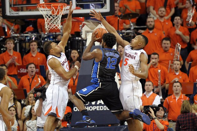 CHARLOTTESVILLE, VA - JANUARY 31: Justise Winslow #12 of the Duke Blue Devils goes to the basket against Justin Anderson #1 and Darion Atkins #5 of the Virginia Cavaliers at John Paul Jones Arena on January 31, 2015 in Charlottesville, Virginia. (Photo by Lance King/Getty Images)