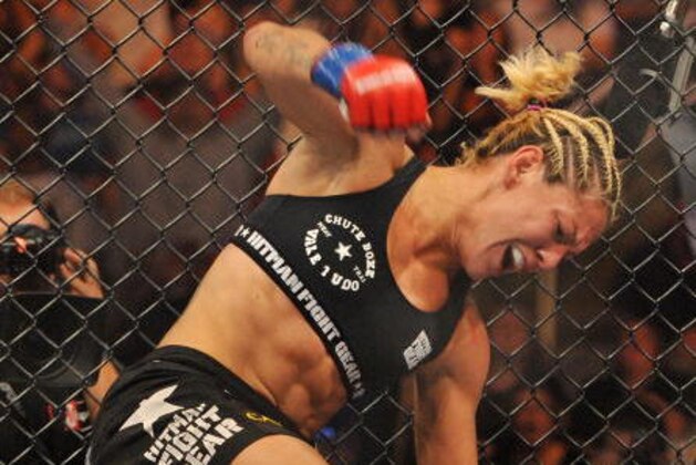 SAN JOSE, CA - AUGUST 15:  Cris Cyborg (Top) battles Gina Carano during their Middleweight  Championship fight at Stikeforce: Carano vs. Cyborg on August 15, 2009 in San Jose, California.  (Photo by Jon Kopaloff/Getty Images)