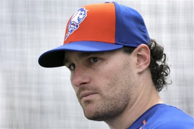 FILE - In this Feb. 26, 2015, file photo, New York Mets' Daniel Murphy pauses while working out in a batting cage during a spring training baseball practice in Port St. Lucie, Fla. Murphy says he disagrees with the