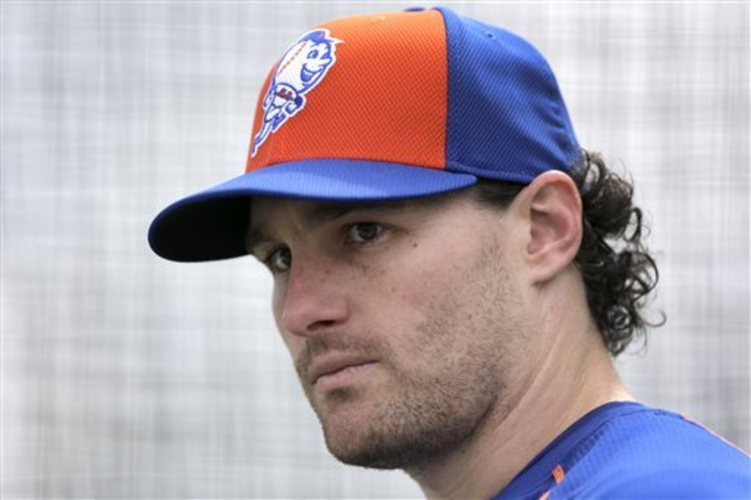 FILE - In this Feb. 26, 2015, file photo, New York Mets' Daniel Murphy pauses while working out in a batting cage during a spring training baseball practice in Port St. Lucie, Fla. Murphy says he disagrees with the