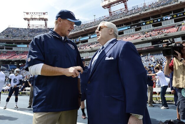 Tommy Smith, president and CEO of the Tennessee Titans, right, talks with head coach Ken Whisenhunt before an NFL football game against the Dallas Cowboys Sunday, Sept. 14, 2014, in Nashville, Tenn. (AP Photo/Mark Zaleski)