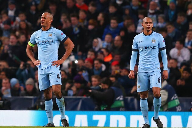MANCHESTER, ENGLAND - FEBRUARY 24:  A dejected Vincent Kompany and Fernando of Manchester City look on during the UEFA Champions League Round of 16 match between Manchester City and Barcelona at Etihad Stadium on February 24, 2015 in Manchester, United Kingdom.  (Photo by Alex Livesey/Getty Images)