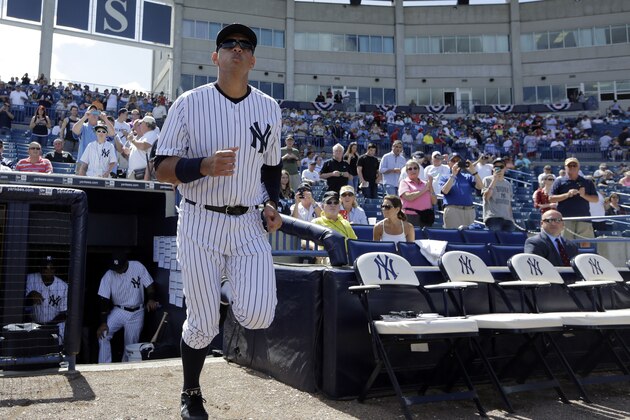 New York Yankees' designated hitter Alex Rodriguez runs out of the dugout as he is introduced before a spring training baseball exhibition game against the Philadelphia Phillies, Wednesday, March 4, 2015, in Tampa, Fla. (AP Photo/Lynne Sladky)