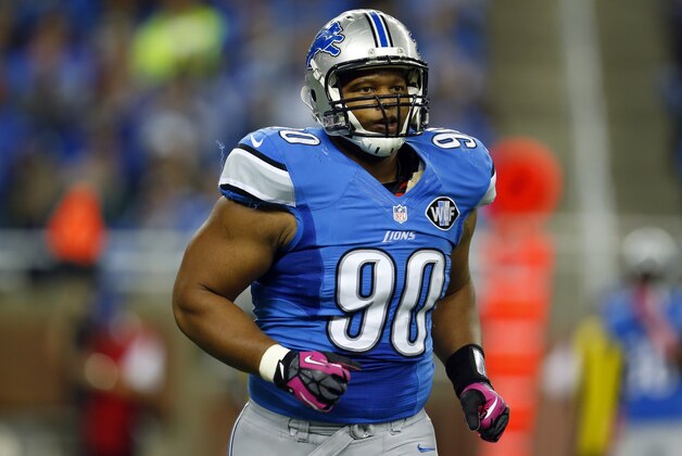Detroit Lions defensive tackle Ndamukong Suh (90) runs off the field during an NFL game against the Buffalo Bills at Ford Field in Detroit on Sunday, Oct. 5, 2014. (Jeff Haynes/AP Images for Panini)