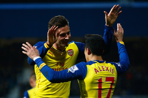 LONDON, ENGLAND - MARCH 04:  Alexis Sanchez of Arsenal (17) celebrates with Olivier Giroud as he scores their second goal during the Barclays Premier League match between Queens Park Rangers and Arsenal at Loftus Road on March 4, 2015 in London, England.  (Photo by Julian Finney/Getty Images)