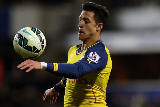 Arsenal’s Alexis Sanchez controls the ball during the English Premier League soccer match between QPR and Arsenal at Loftus Road, London, Wednesday, March 4, 2015. (AP Photo/Tim Ireland)
