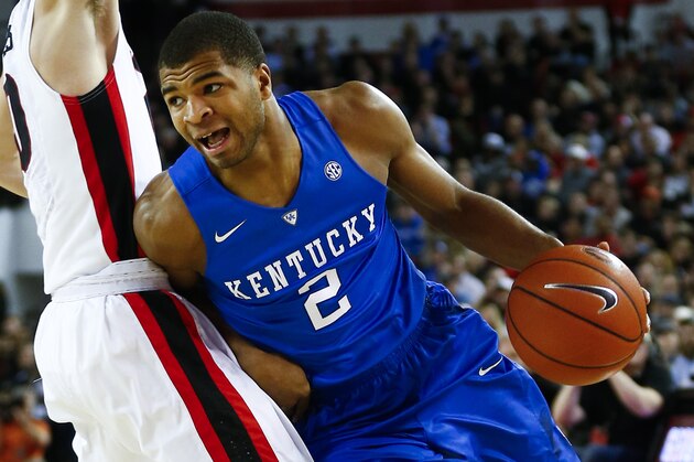 Kentucky guard Aaron Harrison (2) drives against Georgia guard Taylor Echols in the first half of an NCAA college basketball game Tuesday, March 3, 2015, in Athens, Ga. (AP Photo/John Bazemore)