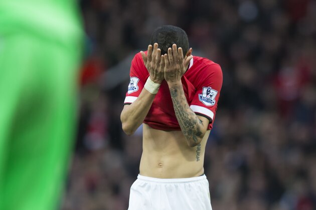 Manchester United's Angel Di Maria reacts after a missed opportunity before being substituted at half time during his team's English Premier League soccer match between Manchester United and Sunderland at Old Trafford Stadium, Manchester, England, Saturday Feb. 28, 2015. (AP Photo/Jon Super)