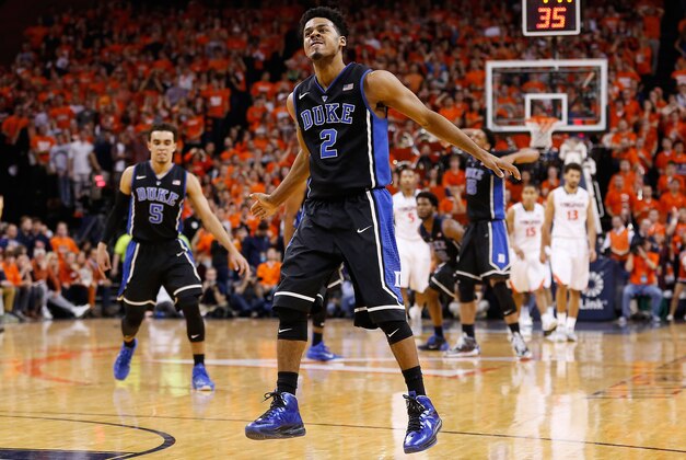 Jan 31, 2015; Charlottesville, VA, USA; Duke Blue Devils guard Quinn Cook (2) celebrates after making a three point field goal against the Virginia Cavaliers in the final minute of the second half at John Paul Jones Arena. The Blue Devils won 69-63. Mandatory Credit: Geoff Burke-USA TODAY Sports