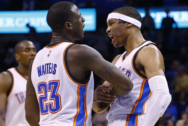 Oklahoma City Thunder guard Dion Waiters (23) and guard Russell Westbrook, right, celebrate in overtime of an NBA basketball game against the Philadelphia 76ers in Oklahoma City, Wednesday, March 4, 2015. Oklahoma City won 123-118. (AP Photo/Sue Ogrocki)