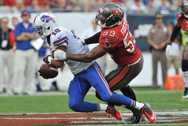 TAMPA, FL -  DECEMBER 8:  Wide receiver Robert Woods #10 of the Buffalo Bills grabs a pass in front of linebacker Mason Foster #59 of the Tampa Bay Buccaneers December 8, 2013 at Raymond James Stadium in Tampa, Florida. (Photo by Al Messerschmidt/Getty Images)