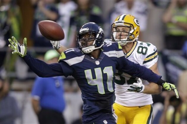 Seattle Seahawks cornerback Byron Maxwell (41) breaks up a pass intended for Green Bay Packers wide receiver Jordy Nelson (87) during the second half of an NFL football game, Thursday, Sept. 4, 2014, in Seattle. (AP Photo/Stephen Brashear)