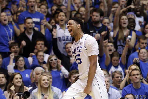 Duke's Jahlil Okafor reacts following a basket against North Carolina during the second half of an NCAA college basketball game in Durham, N.C., Wednesday, Feb. 18, 2015. Duke won 92-90 in overtime. (AP Photo/Gerry Broome)