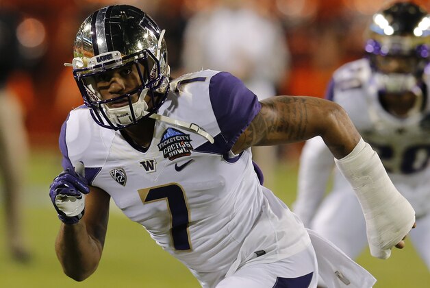 Washington linebacker Shaq Thompson (7) in the first half during the Cactus Bowl NCAA college football game against Oklahoma State, Friday, Jan. 2, 2015, in Tempe, Ariz. (AP Photo/Rick Scuteri)