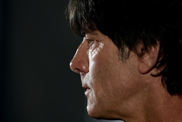 German head coach Joachim Loew watches  the media during a press conference in Kamen, Germany, ahead of the UEFA EURO 2016 qualifying soccer match between Germany and Scotland, Saturday, Sept. 6, 2014. (AP Photo/Martin Meissner)