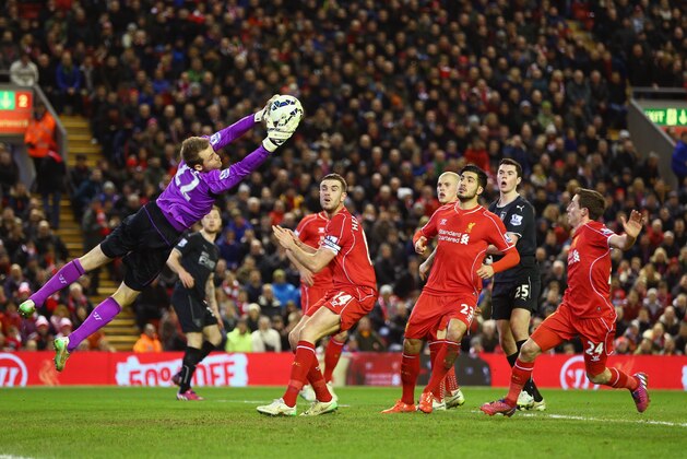 LIVERPOOL, ENGLAND - MARCH 04:  Simon Mignolet of Liverpool makes a save during the Barclays Premier League match between Liverpool and Burnley at Anfield on March 4, 2015 in Liverpool, England.  (Photo by Michael Steele/Getty Images)