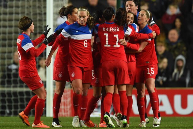 MILTON KEYNES, ENGLAND - FEBRUARY 13:  Alex Morgan of the United States (3R) celebrates with team mates as she scores their first goal during the Women's Friendly International match between England and USA at Stadium mk on February 13, 2015 in Milton Keynes, England.  (Photo by Tom Dulat/Getty Images)