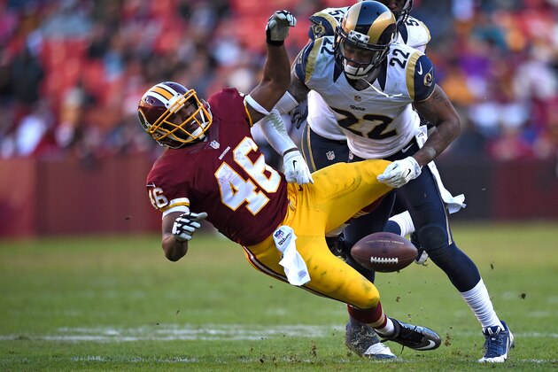 LANDOVER, MD - DECEMBER 07: Cornerback Trumaine Johnson #22 of the St. Louis Rams hits running back Alfred Morris #46 of the Washington Redskins in the second half at FedExField on December 7, 2014 in Landover, Maryland. The St. Louis Rams won, 24-0. (Photo by Patrick Smith/Getty Images)