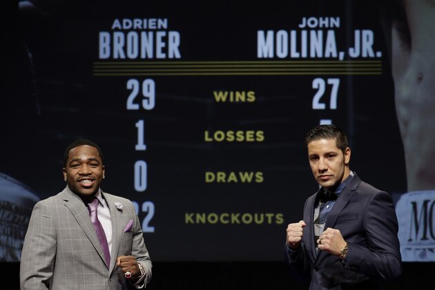 Boxers Adrien Broner, left, and John Molina, Jr. pose for pictures during a news conference in New York, Wednesday, Jan. 14, 2015. The match between these two boxers will be broadcast in prime time on March 7, 2015, as part of the Premiere Boxing Champions series on NBC. (AP Photo/Seth Wenig)