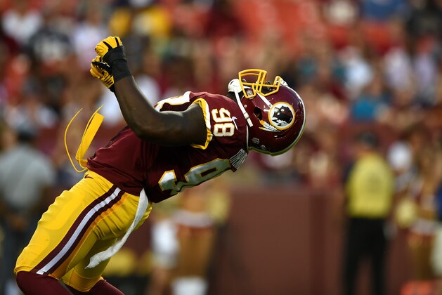 LANDOVER, MD - AUGUST 07: Outside linebacker Brian Orakpo #98 of the Washington Redskins celebrates after sacking quarterback Ryan Mallett #15 of the New England Patriots (not pictured) in the first quarter during a preseason NFL game at FedExField on August 7, 2014 in Landover, Maryland. (Photo by Patrick Smith/Getty Images)
