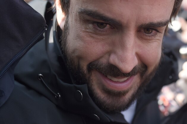 Fernando Alonso of Spain and McLaren Honda smiles during the 2015 Formula One testing at the Barcelona Catalunya racetrack in Montmelo, Spain, Friday, Feb. 20, 2015. (AP Photo/Manu Fernandez)