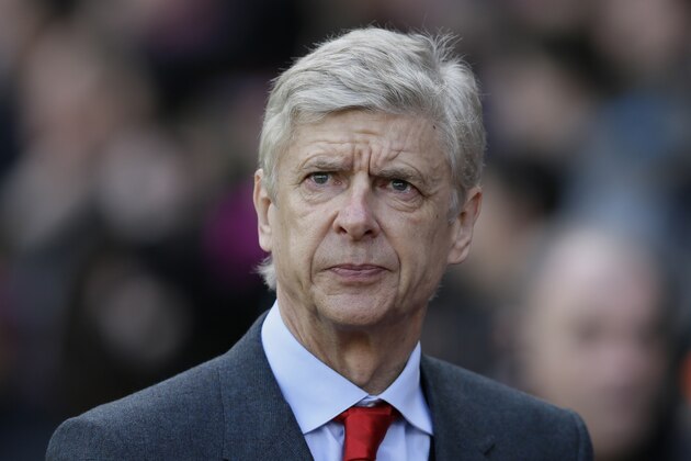 Arsenal manager Arsene Wenger looks across the pitch ahead of the English Premier League soccer match between Crystal Palace and Arsenal at Selhurst Park, London, Saturday, Feb. 21, 2015. (AP Photo/Tim Ireland)