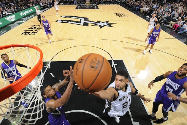 SAN ANTONIO - MARCH 4: Tim Duncan #21 of the San Antonio Spurs goes up for a shot against the Sacramento Kings at the AT&T Center on March 4, 2014 in San Antonio, Texas. NOTE TO USER: User expressly acknowledges and agrees that, by downloading and or using this photograph, user is consenting to the terms and conditions of the Getty Images License Agreement. Mandatory Copyright Notice: Copyright 2015 NBAE (Photos by D. Clarke Evans/NBAE via Getty Images)