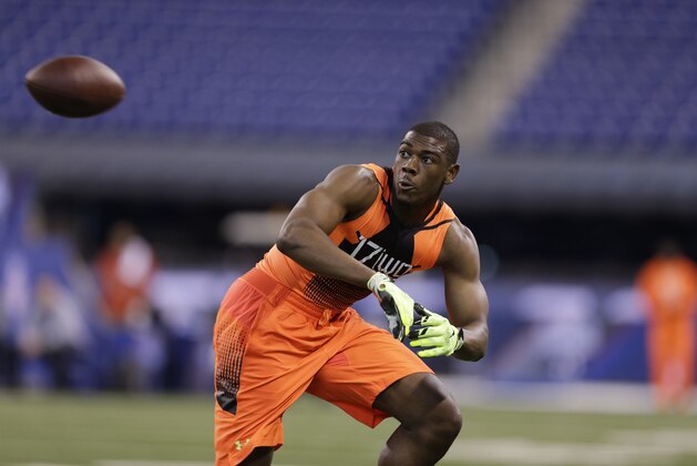 Michigan wide receiver Devin Funchess runs a drill at the NFL football scouting combine in Indianapolis, Saturday, Feb. 21, 2015. (AP Photo/David J. Phillip)