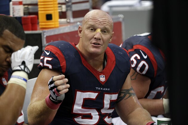 Houston Texans center Chris Myers (55) talks on the sideline during the second half of an NFL football game against the Dallas Cowboys, Sunday, Oct. 5, 2014, in Arlington, Texas. (AP Photo/Tim Sharp)