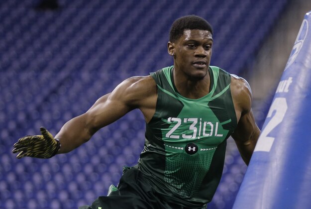 Nebraska defensive lineman Randy Gregory runs a drill at the NFL football scouting combine in Indianapolis, Sunday, Feb. 22, 2015. (AP Photo/David J. Phillip)