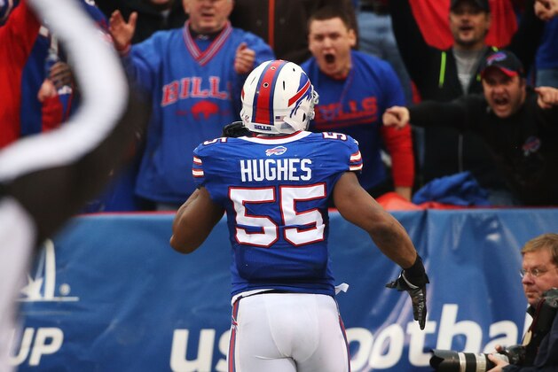 ORCHARD PARK, NY - NOVEMBER 30:  Jerry Hughes #55 of the Buffalo Bills runs in a fumble for a touchdown against the Cleveland Browns during the second half at Ralph Wilson Stadium on November 30, 2014 in Orchard Park, New York.  (Photo by Tom Szczerbowski/Getty Images)
