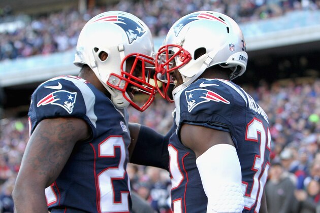 FOXBORO, MA - DECEMBER 14:  Darrelle Revis #24 and Devin McCourty #32 of the New England Patriots react after McCourty broke up a pass during the first quarter against the Miami Dolphins at Gillette Stadium on December 14, 2014 in Foxboro, Massachusetts.  (Photo by Jim Rogash/Getty Images)
