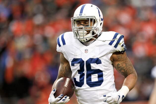 Indianapolis Colts running back Dan Herron celebrates as he runs to the bench after scoring a touchdown against the Denver Broncos during the first half of an NFL divisional playoff football game, Sunday, Jan. 11, 2015, in Denver. (AP Photo/David Zalubowski)