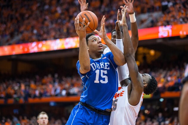 SYRACUSE, NY - FEBRUARY 14:  Jahlil Okafor #15 of the Duke Blue Devils drives to the basket against Rakeem Christmas #25 of the Syracuse Orange during the second half on February 14, 2015 at The Carrier Dome in Syracuse, New York.  Duke defeats Syracuse 80-72.  (Photo by Brett Carlsen/Getty Images)