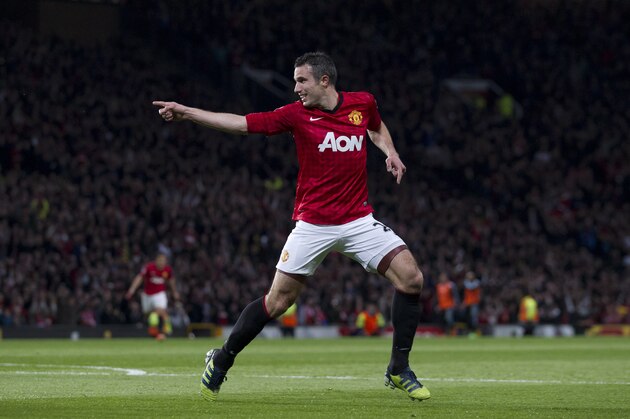 Manchester United's Robin van Persie celebrates after scoring his third goal against Aston Villa during their English Premier League soccer match at Old Trafford Stadium, Manchester, England, Monday April 22, 2013. (AP Photo/Jon Super)