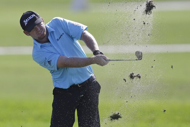 J.B. Holmes hits on the second fairway during the first round of the Cadillac Championship golf tournament, Thursday, March 5, 2015, in Doral, Fla. (AP Photo/Wilfredo Lee)
