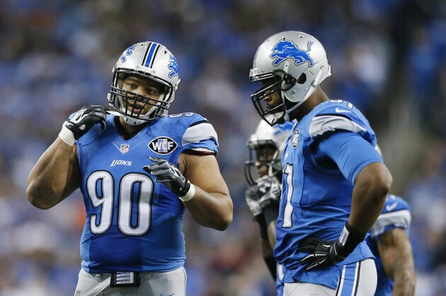 Detroit Lions defensive tackle Ndamukong Suh (90) is seen during the first half of an NFL football game against the Chicago Bears in Detroit, Thursday, Nov. 27, 2014. (AP Photo/Rick Osentoski)
