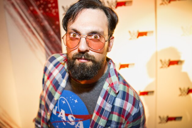 IMAGE DISTRIBUTED FOR 2K - WWE Superstar Damien Sandow, dressed as a stereotypical gamer, at the WWE 2K15 Press Event at Cicada Restaurant, on Saturday, August 16, 2014 in Los Angeles. (Photo by Colin Young-Wolff/Invision for 2K/AP Images)