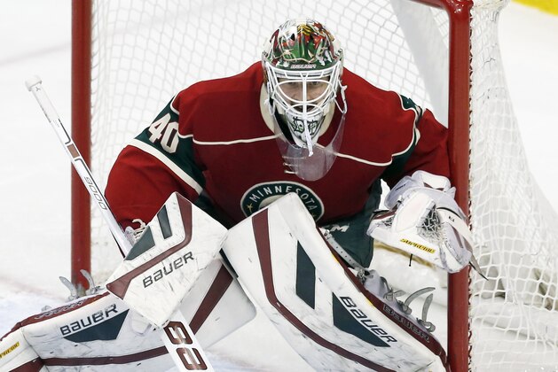 Minnesota Wild goalie Devan Dubnyk defends the net in the first period of an NHL hockey game against the Ottawa Senators, Tuesday, March 3, 2015, in St. Paul, Minn. (AP Photo/Jim Mone)